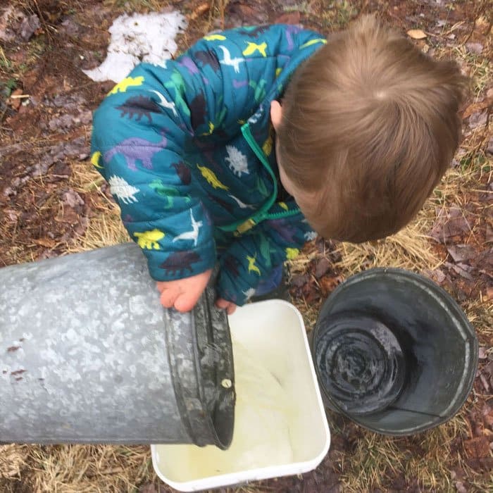 child pouring sap