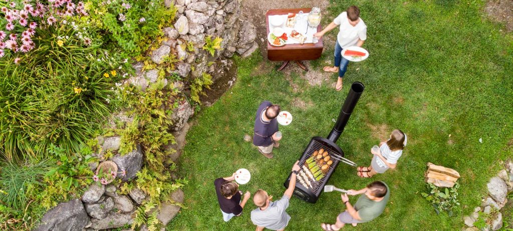 overhead view of group of people in lawn grilling on evaporator