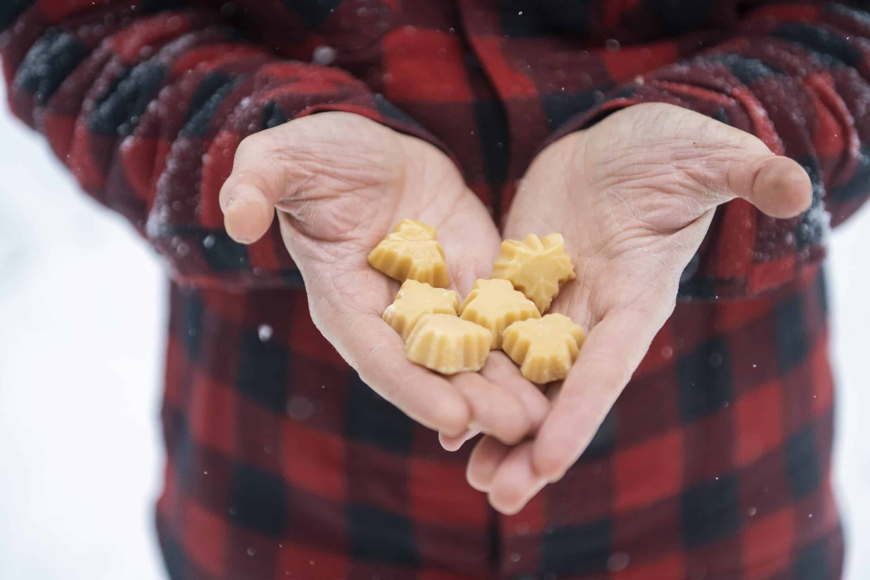 Maple Makes the Holiday Meal: Hands hold maple candy