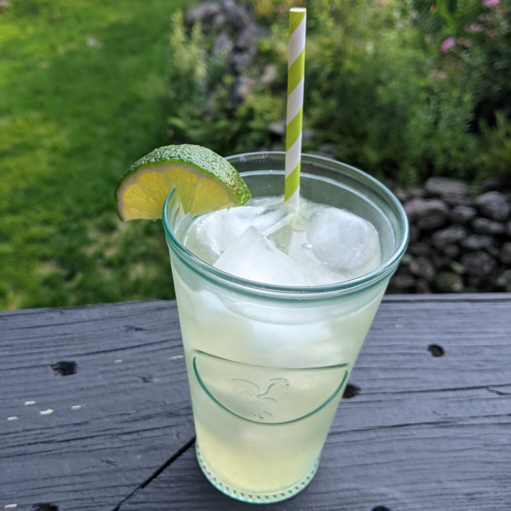 Maple lime fizz in glass with straw.