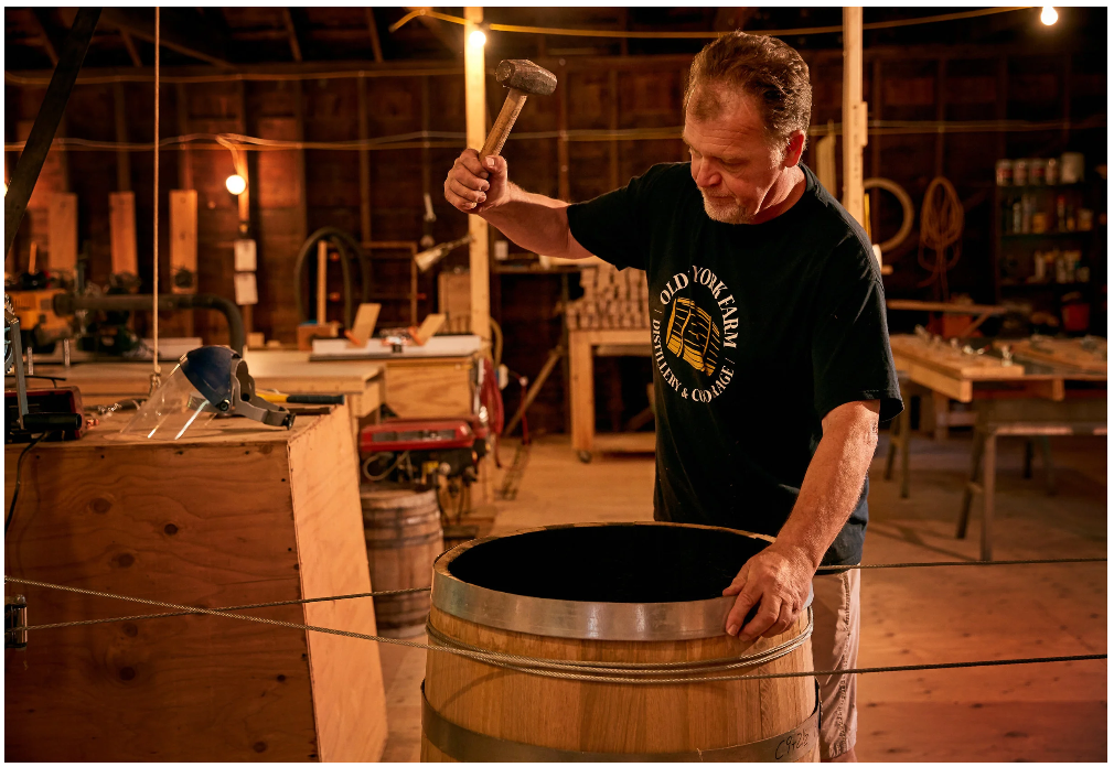 A man making a barrel.