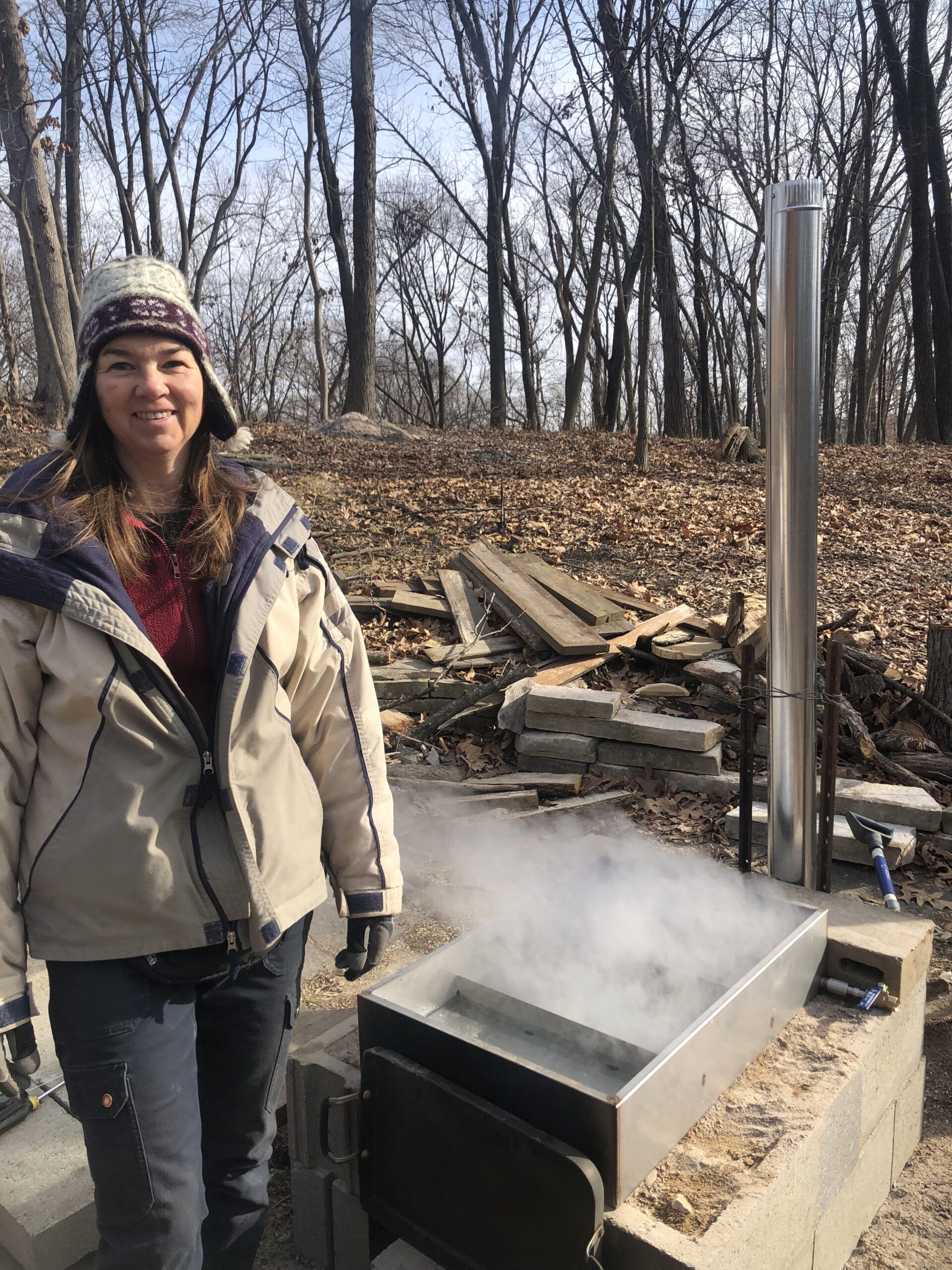 A woman next to an evaporator.